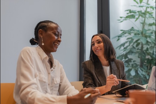 Two women discussing a report