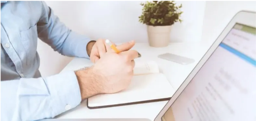 a person writing on a paper